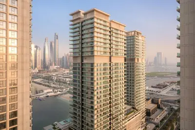 an aerial view of a tall building in a city at FIRST CLASS 2BR Sea & Palm View, Beachfront in Dubai