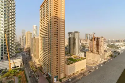 an aerial view of a city with tall buildings at Modern JVC Studio with Pool Gym and Easy Access to Attractions in Dubai