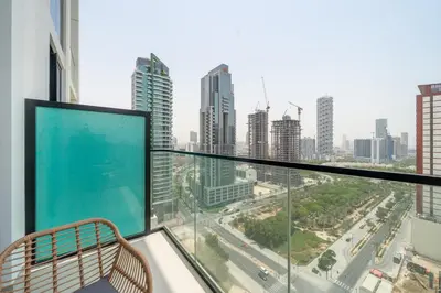 a balcony with a view of a city at Homes & Beyond l Serene 1BR Retreat in JVC in Dubai