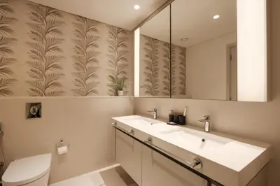 a bathroom with a sink and a toilet and a mirror at Elegant 2BR with Dubai Marina Skyline & Sunset Views in Dubai