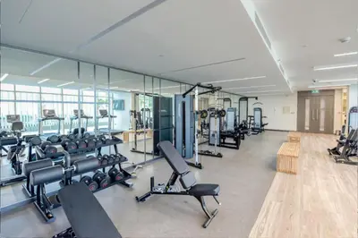 a gym with rows of treadmills and machines at Elegant 2BR with Dubai Marina Skyline & Sunset Views in Dubai