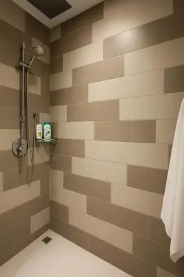 a bathroom with a brown and tan striped wall at Happy Dom Palm in Dubai