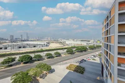 an aerial view of a city street with a parking lot at Perfect Midtown Studio Bright & Stylish in Dubai