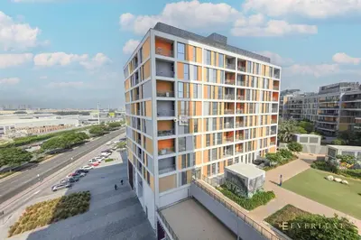 an overhead view of a tall building with a street at Stylish 1br In Midtown Impz Soft Modern Vibes in Dubai
