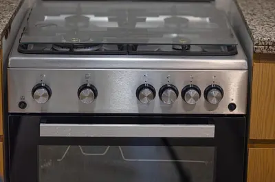 a stainless steel stove in a kitchen at Luxury 2,5BR Burj Khalifa Views with Pool and Gym Access Near Dubai Mall in Dubai