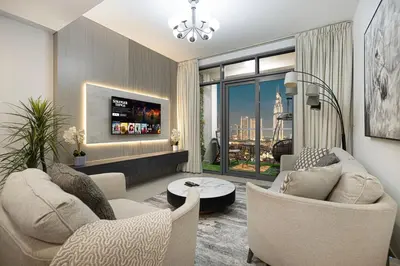 a living room with two couches and a table at Luxury 2,5BR Burj Khalifa Views with Pool and Gym Access Near Dubai Mall in Dubai
