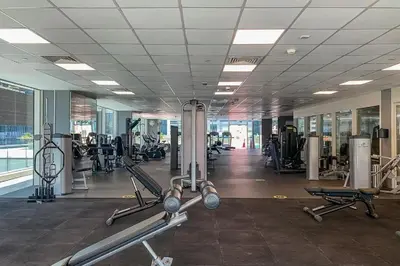 a gym with treadmills and machines in a building at Marina Heights 1 - Opulent One Bedroom in Marina in Dubai