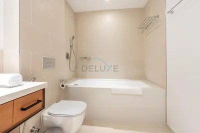 a bathroom with a toilet and a bath tub at High Rise Apartment with Direct Access to Marina Walk, Near JBR, Marina Mall and Dubai Dining Hotspots, VIDA Residences, Dubai Marina by Deluxe Holiday Homes in Dubai