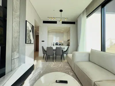 a living room with a couch and a table at Private Pool II Spacious II Brand New in Dubai