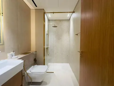 a bathroom with a toilet and a sink and a shower at Brand New with Private Jacuzzi in Dubai