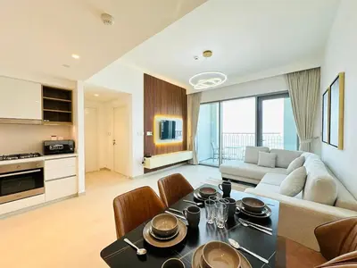 a living room with a couch and a table at Zabeel View I Fully Furnished I Prime Location in Dubai