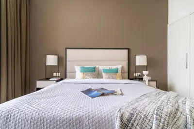 a bedroom with a bed with two books on it at The Smart Concierge - Damac 108 in Dubai