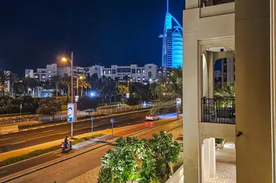 a view of a city at night from a building at Luxurious Apartment in the Heart of Dubai in Dubai