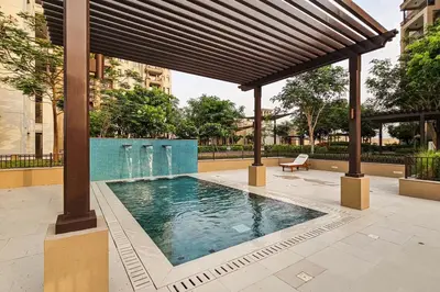 a swimming pool under a pavilion in a building at Luxurious Apartment in the Heart of Dubai in Dubai
