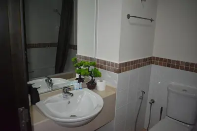 a bathroom with a sink and a toilet at Cozy 2BR -Near JBR Beach &Metro in Dubai