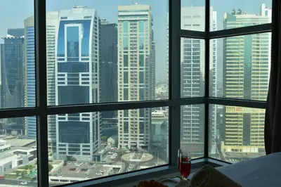 a view of a city skyline from a window at Cozy 2BR -Near JBR Beach &Metro in Dubai