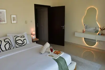 a bedroom with a bed with a tray of food on it at Cozy 2BR -Near JBR Beach &Metro in Dubai