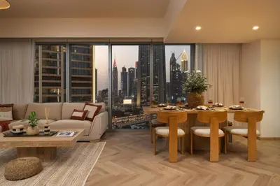 a living room with a view of a city at Seraya Residence 19 - 4BDR - 180 Burj View & DIFC views in Dubai