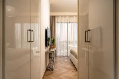 a bathroom with a sliding glass door with a television at Seraya Residence 20 - 4BDR - Burj View with direct access to Dubai Mall in Dubai