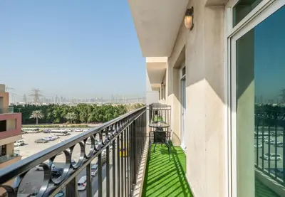 a balcony with a view of a parking lot at Zapbed House-Stylish 2 BR in May Residence Block 1 -JVC in Dubai