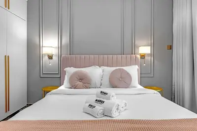 a hotel room with a bed with towels on it at Waves - Gold Opulence 1 BR in Marina in Dubai