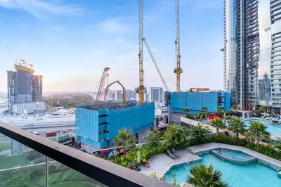 a view of a construction site with cranes at Cozy 2BR Pool & City Views in Dubai