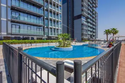 a swimming pool in the middle of a building at HAVN - High Floor Studio in Bloom Towers, JVC in Dubai