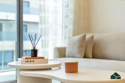 a living room with a couch and a coffee table at Peaceful 2BR with Community Views by BMS in Dubai