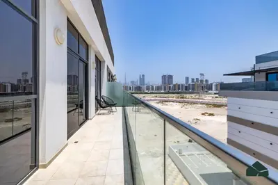 a balcony of a building with a view of the city at Peaceful 2BR with Community Views by BMS in Dubai