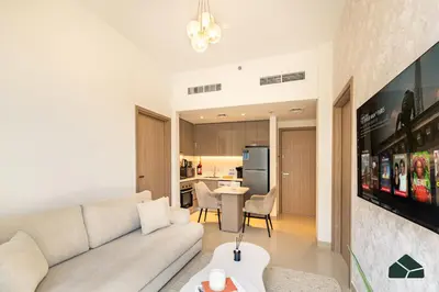 a living room with a couch and a table at Peaceful 2BR with Community Views by BMS in Dubai
