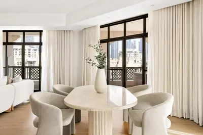 a dining room with a table and chairs at DAYF-ROD Luxurious 2 Bed Apartment in Souk Al Bahar in Dubai