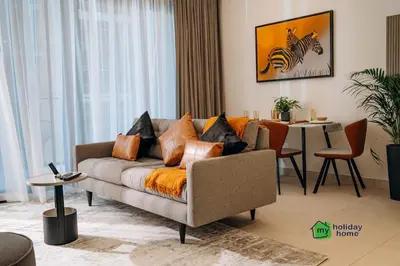 a living room with a couch and a table at Amazing brand new 2BR - Business Bay-Binghatti in Dubai