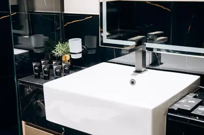 a bathroom with a white sink and a mirror at Amazing brand new 2BR - Business Bay-Binghatti in Dubai