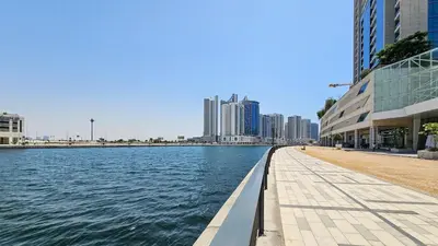 a view of a river in a city with buildings at Luxurious Lake View 1BR - Business Bay - Pool - Gym in Dubai