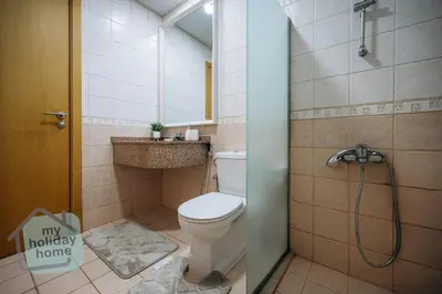 a bathroom with a toilet and a shower at Beautiful 1BR-Fully Furnished- Balcony-Pool & Gym in Dubai