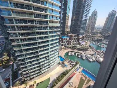 an aerial view of a large building with a marina at Luxury 2BR in Cayan Tower with Stunning Views in Dubai