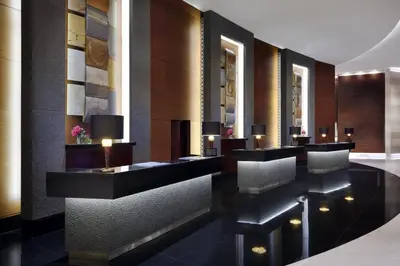 a lobby with desks and chairs in a building at Dubai Marina Luxury Lifestyle - Sun Sand & Views in Dubai