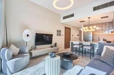 a living room with a couch and a table at Sky-High Luxury 1BR in 27th Floor MBL Residence in Dubai