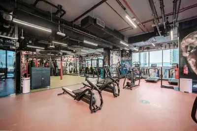 a gym with several exercise bikes in a room at Sky-High Luxury 1BR in 27th Floor MBL Residence in Dubai