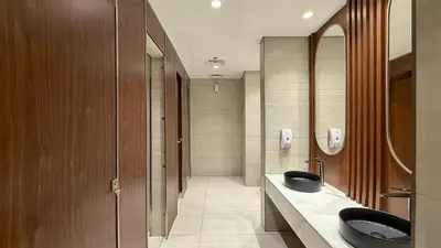 a bathroom with two sinks and a mirror at Luxe Haven 1BR8min drive DubaiMall & BurjKhalifa in Dubai