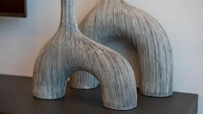 a couple of vases sitting on top of a table at Luxury Comfort 1BRNear Dubai Mall & Burj Khalifa in Dubai