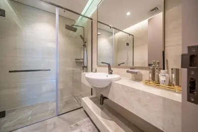 a bathroom with a sink and a shower at GEM 2BR Prime Location 8 Min to Burj Khalifa in Dubai