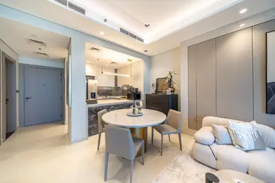 a living room with a table and a couch at GEM 2BR Prime Location 8 Min to Burj Khalifa in Dubai