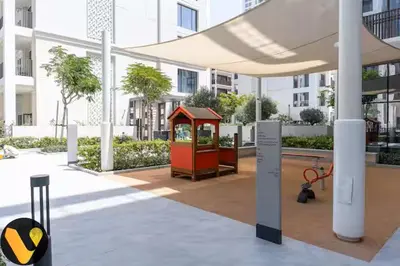 a building with a gazebo in a courtyard at Vogue Creek Beach Rosewater Waterfront Living close to Downtown, Burj Khalifa and Dubai mall, Two Bedroom Apartment with Balcony and Vibrant Community View, Private Manmade Beach, Access to all Amenities in Sabkhah