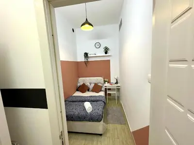 a small room with a bed and a table at Attractive Partition Room Tecom Barsha Heights in Dubai