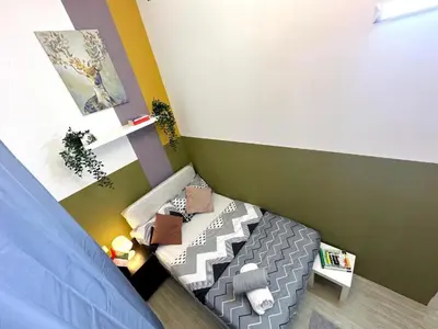 a small bedroom with a bed in a room at Pleasing Partition Room Barsha Heights tecom in Dubai
