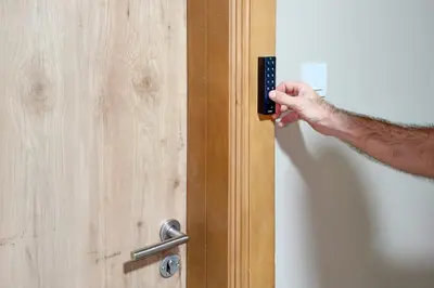 a person holding a remote control in a door at Jumeirah Beach Residences Private Beach & Sea View in Dubai
