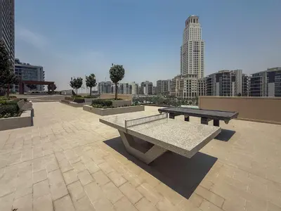 a park with benches and a view of a city at Frank Porter - Creek Palace in Dubai