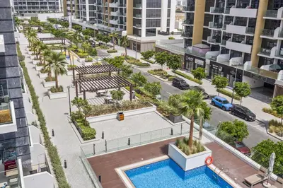 an aerial view of an apartment complex with a pool at Elite Escape - Getaway in Azizi Riviera 13 in Dubai
