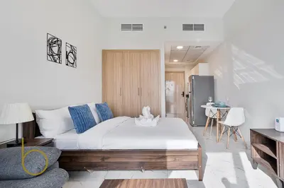 a living room with a bed and a couch at Bookable - Alexis Tower, Studio Room with Balcony in Dubai
